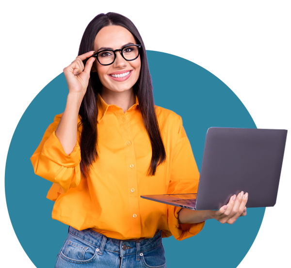 woman in glasses with laptop looking at camera